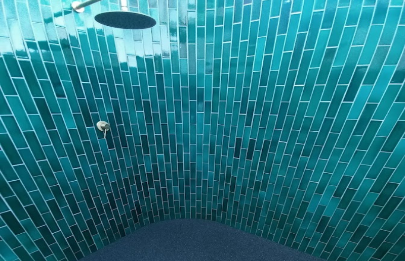 Teal tile feature wall shower installation