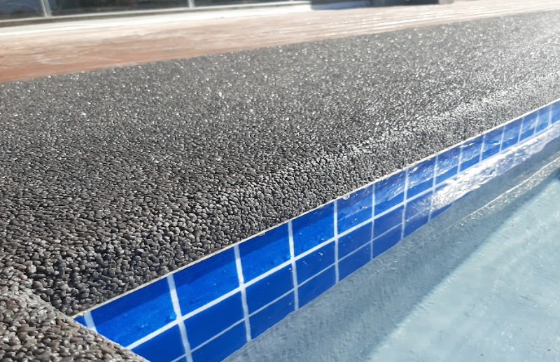 Quartz carpet flooring around swimming pool edge